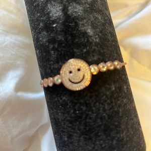 Rose gold plated adjustable bracelet. Smiley face